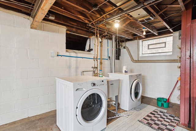 washroom featuring washing machine and dryer and laundry area