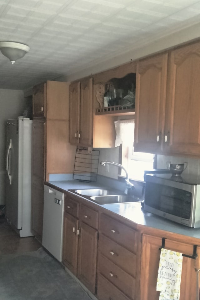 kitchen featuring appliances with stainless steel finishes and a sink