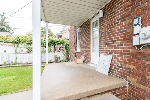 view of patio with central AC unit and fence