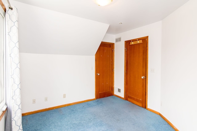additional living space featuring visible vents, baseboards, and carpet floors