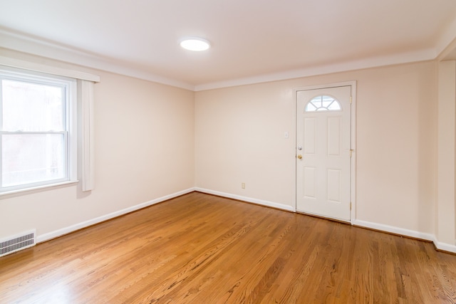 entryway featuring baseboards, visible vents, and light wood-style floors