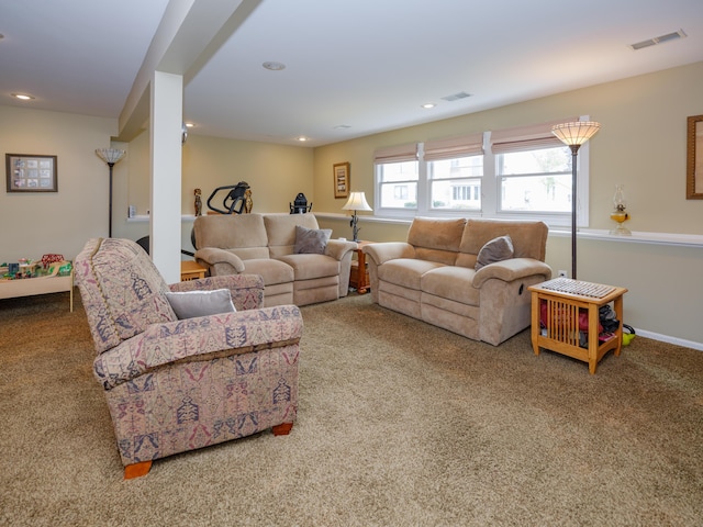 carpeted living area featuring visible vents, baseboards, and recessed lighting