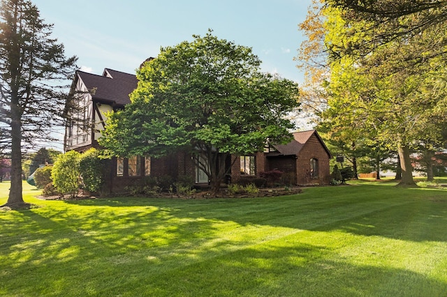 3603 Creekside Dr, Ann Arbor, MI 48105 - exterior space featuring a lawn, brick siding, and a shingled roof
