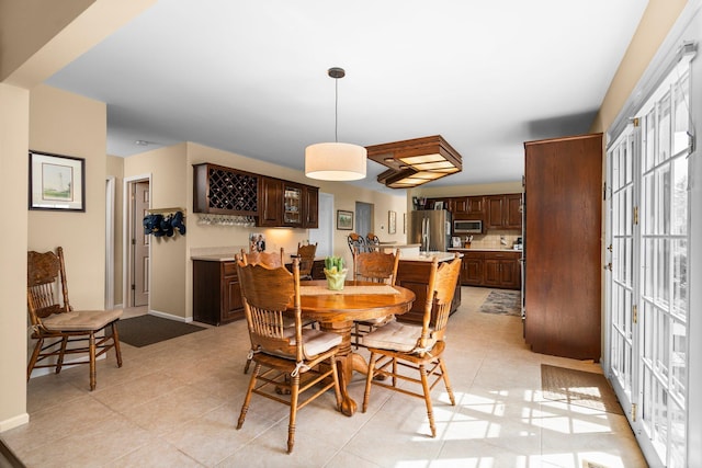 3603 Creekside Dr, Ann Arbor, MI 48105 - dining area with light tile patterned flooring and baseboards