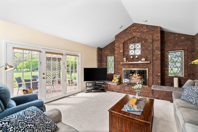 3603 Creekside Dr, Ann Arbor, MI 48105 - living room featuring a brick fireplace, brick wall, carpet floors, and vaulted ceiling