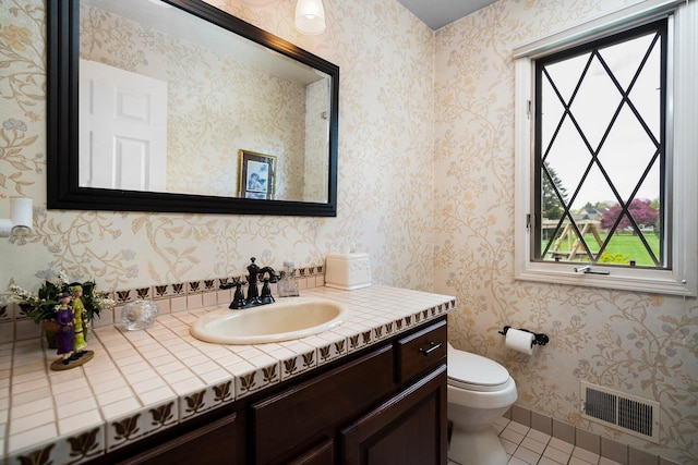 3603 Creekside Dr, Ann Arbor, MI 48105 - bathroom with toilet, visible vents, baseboards, tile patterned flooring, and vanity
