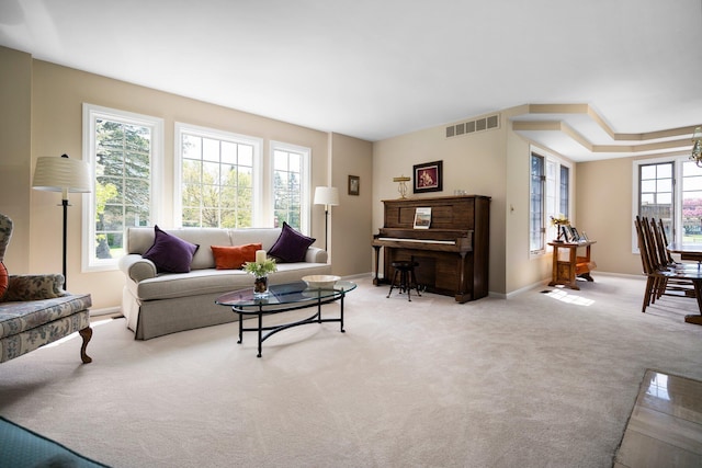 3603 Creekside Dr, Ann Arbor, MI 48105 - living room with an inviting chandelier, carpet floors, baseboards, and visible vents