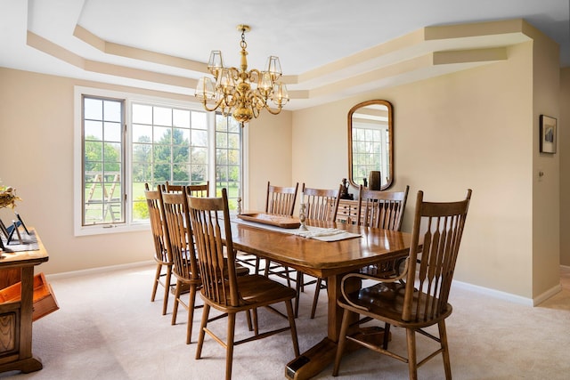 3603 Creekside Dr, Ann Arbor, MI 48105 - dining area with an inviting chandelier, light carpet, baseboards, and a raised ceiling