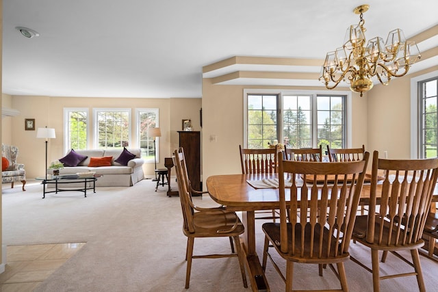 3603 Creekside Dr, Ann Arbor, MI 48105 - carpeted dining space with an inviting chandelier