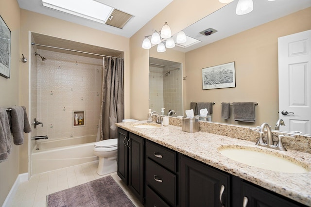 3603 Creekside Dr, Ann Arbor, MI 48105 - bathroom featuring toilet, shower / tub combo, double vanity, and a sink