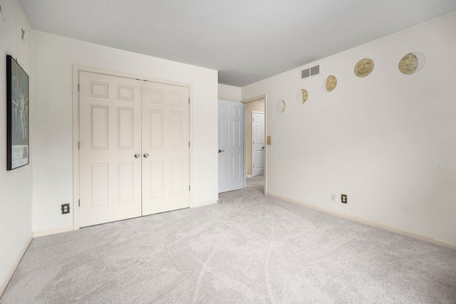 3603 Creekside Dr, Ann Arbor, MI 48105 - unfurnished bedroom featuring carpet, baseboards, a closet, and visible vents