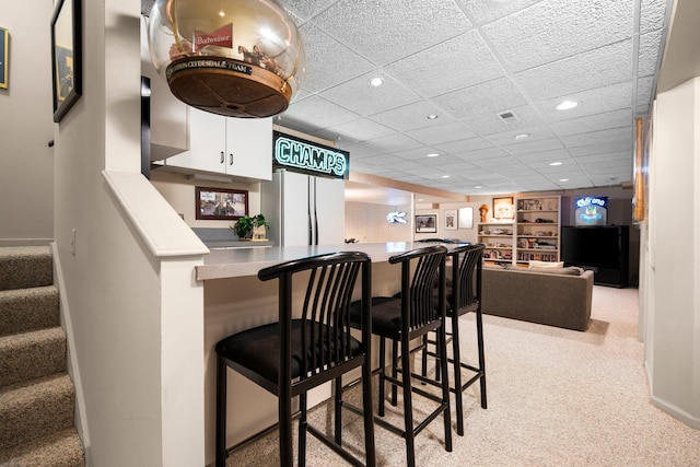 3603 Creekside Dr, Ann Arbor, MI 48105 - bar with carpet, freestanding refrigerator, a paneled ceiling, bar area, and recessed lighting