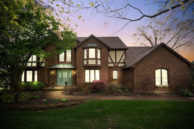 3603 Creekside Dr, Ann Arbor, MI 48105 - english style home with a shingled roof, brick siding, and a front yard