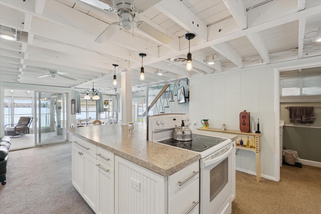 10458 Sleepy Hollow Ln, Mecosta, MI 49332 - kitchen featuring white range with electric stovetop, a ceiling fan, light colored carpet, a kitchen island, and white cabinets
