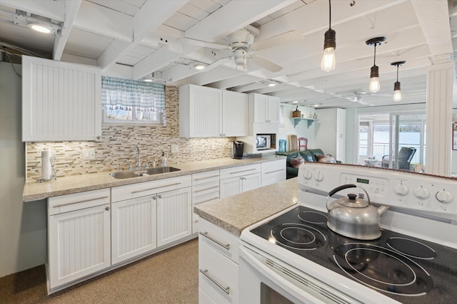 10458 Sleepy Hollow Ln, Mecosta, MI 49332 - kitchen with white electric range oven, a sink, plenty of natural light, a ceiling fan, and beam ceiling