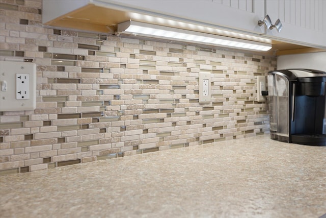 10458 Sleepy Hollow Ln, Mecosta, MI 49332 - kitchen view of backsplash, light countertops, and white cabinetry