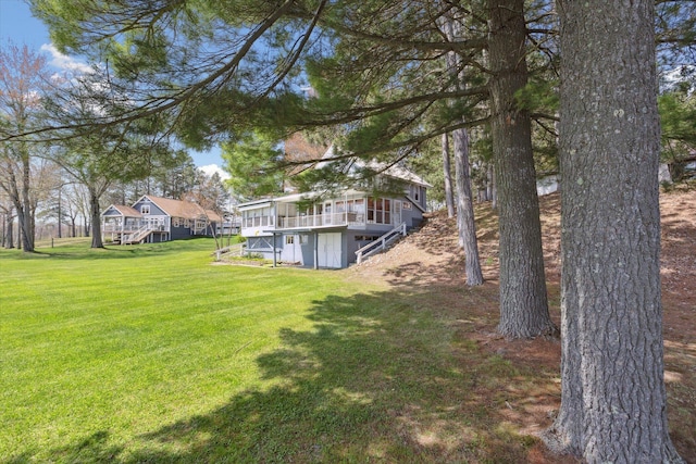 10458 Sleepy Hollow Ln, Mecosta, MI 49332 - view of grassy yard with stairway and a deck
