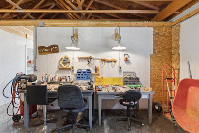 10458 Sleepy Hollow Ln, Mecosta, MI 49332 - office area with a workshop area and unfinished concrete floors