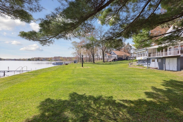 10458 Sleepy Hollow Ln, Mecosta, MI 49332 - view of grassy yard featuring a deck with water view and stairway