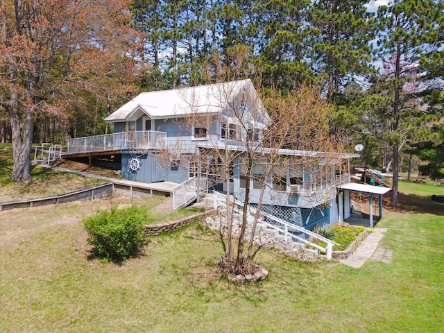 10458 Sleepy Hollow Ln, Mecosta, MI 49332 - back of house with a deck, stairs, and a lawn