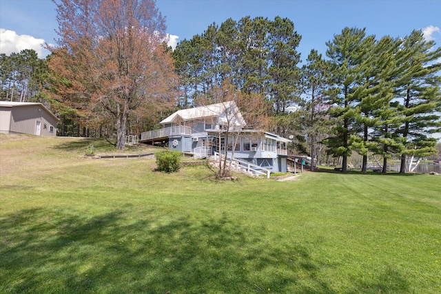 10458 Sleepy Hollow Ln, Mecosta, MI 49332 - view of grassy yard with a deck