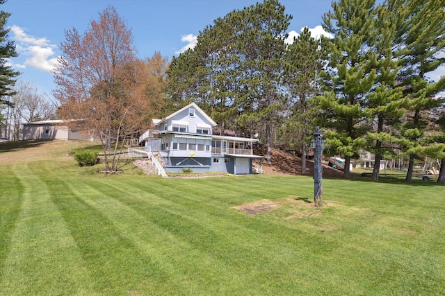 10458 Sleepy Hollow Ln, Mecosta, MI 49332 - back of house featuring a yard and a deck