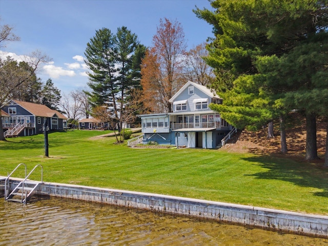 10458 Sleepy Hollow Ln, Mecosta, MI 49332 - rear view of house featuring a wooden deck and a lawn