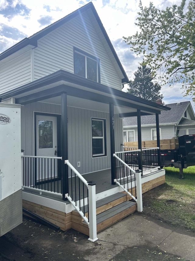 view of front of house with board and batten siding and a porch