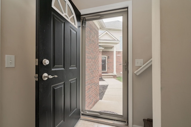 entrance foyer with brick wall