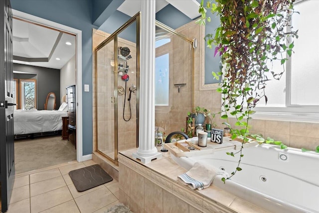 ensuite bathroom featuring ensuite bath, tile patterned flooring, a stall shower, and a jetted tub