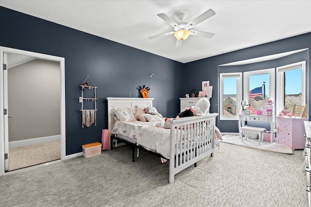 bedroom with carpet floors, baseboards, and ceiling fan