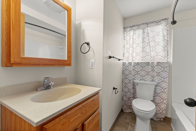 bathroom with toilet and vanity