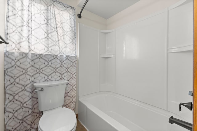 full bathroom featuring toilet and  shower combination