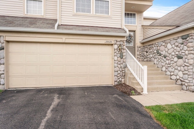 garage featuring driveway
