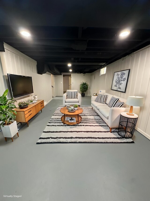 living room featuring concrete flooring and recessed lighting