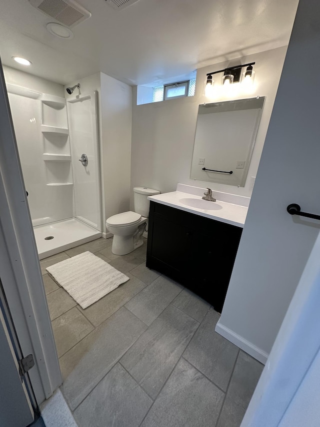 full bathroom featuring a walk in shower, toilet, visible vents, and vanity