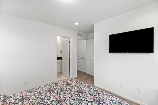 unfurnished bedroom with baseboards, light colored carpet, and recessed lighting