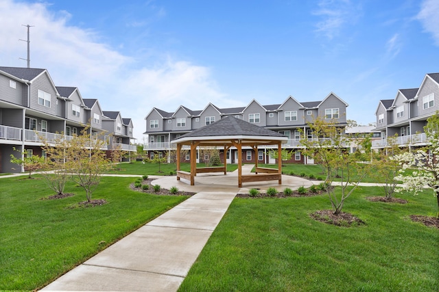 surrounding community with a residential view, a gazebo, and a yard