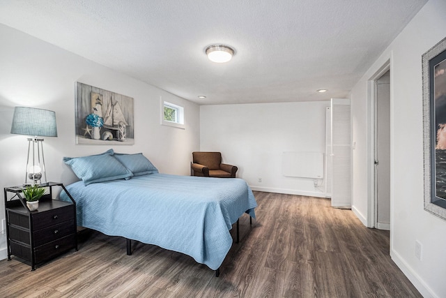 3012 Lansdowne Rd, Waterford, MI 48329 - bedroom with wood finished floors, baseboards, a textured ceiling, and recessed lighting
