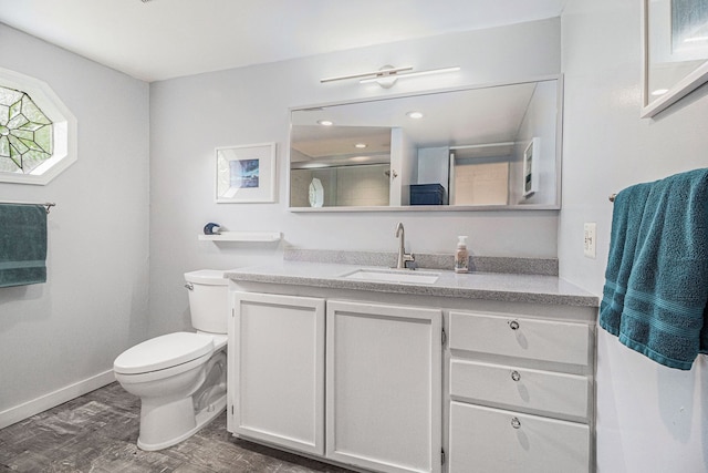 3012 Lansdowne Rd, Waterford, MI 48329 - bathroom with toilet, vanity, baseboards, an enclosed shower, and wood finished floors