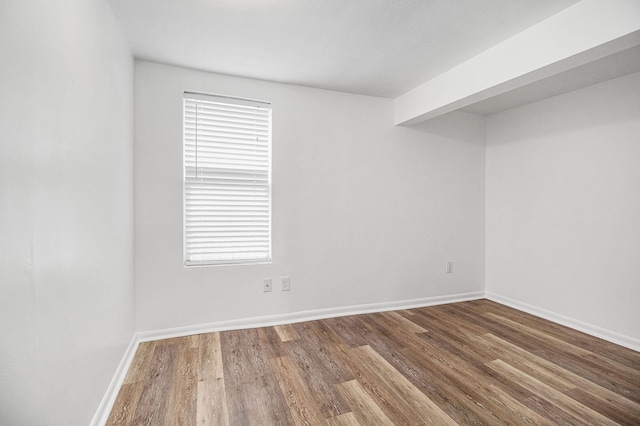 3012 Lansdowne Rd, Waterford, MI 48329 - empty room with wood finished floors and baseboards