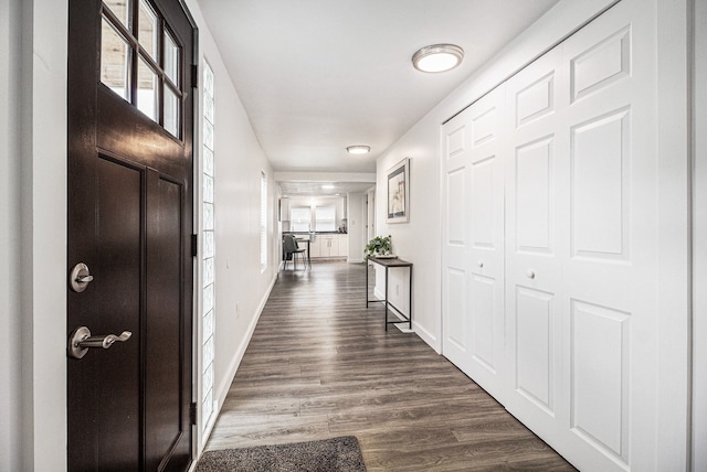 3012 Lansdowne Rd, Waterford, MI 48329 - hallway featuring baseboards and dark wood finished floors