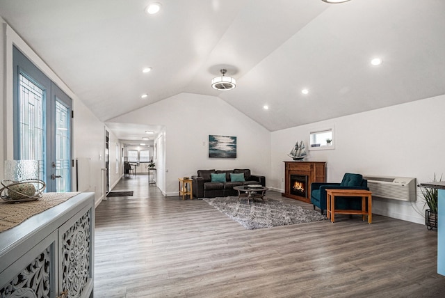 3012 Lansdowne Rd, Waterford, MI 48329 - living room with wood finished floors, a lit fireplace, vaulted ceiling, recessed lighting, and baseboards