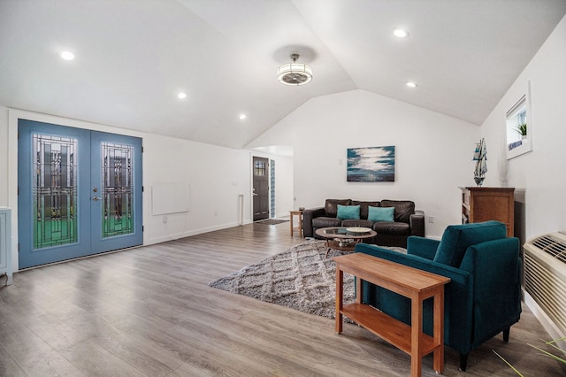 3012 Lansdowne Rd, Waterford, MI 48329 - living room featuring lofted ceiling, french doors, wood finished floors, and recessed lighting