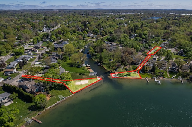 3012 Lansdowne Rd, Waterford, MI 48329 - aerial view of property and surrounding area featuring a large body of water, property parcel outlined, and a forest