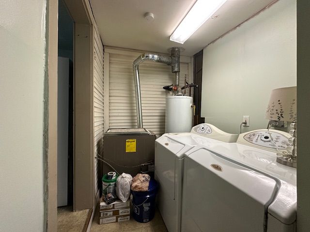 19916 Salem St, Detroit, MI 48219 - washroom with separate washer and dryer, laundry area, and water heater