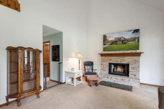 11104 Southbrook Dr, Ceresco, MI 49033 - carpeted living room featuring a brick fireplace, a high ceiling, and baseboards
