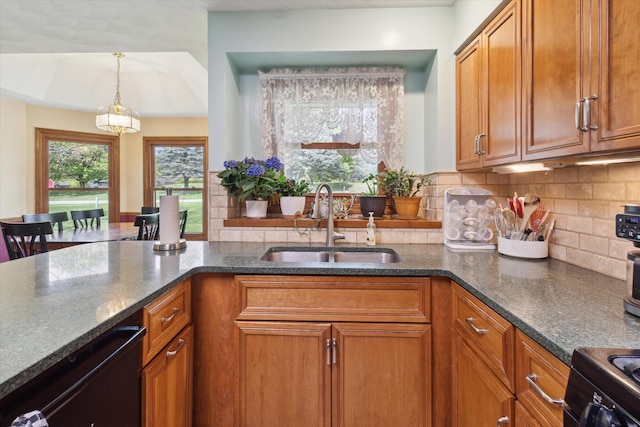 11104 Southbrook Dr, Ceresco, MI 49033 - kitchen with a sink, brown cabinets, black appliances, and dark stone counters