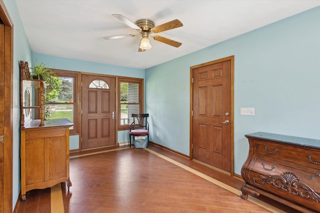 11104 Southbrook Dr, Ceresco, MI 49033 - foyer entrance featuring wood finished floors, a ceiling fan, and baseboards