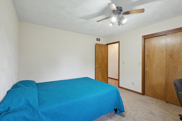 11104 Southbrook Dr, Ceresco, MI 49033 - bedroom with light colored carpet, a ceiling fan, baseboards, and a closet